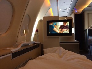 My seat becomes by bed, complete with comforter, and it is time for a movie and some sleep. Bonus points to whomever can tell me what the movie is.